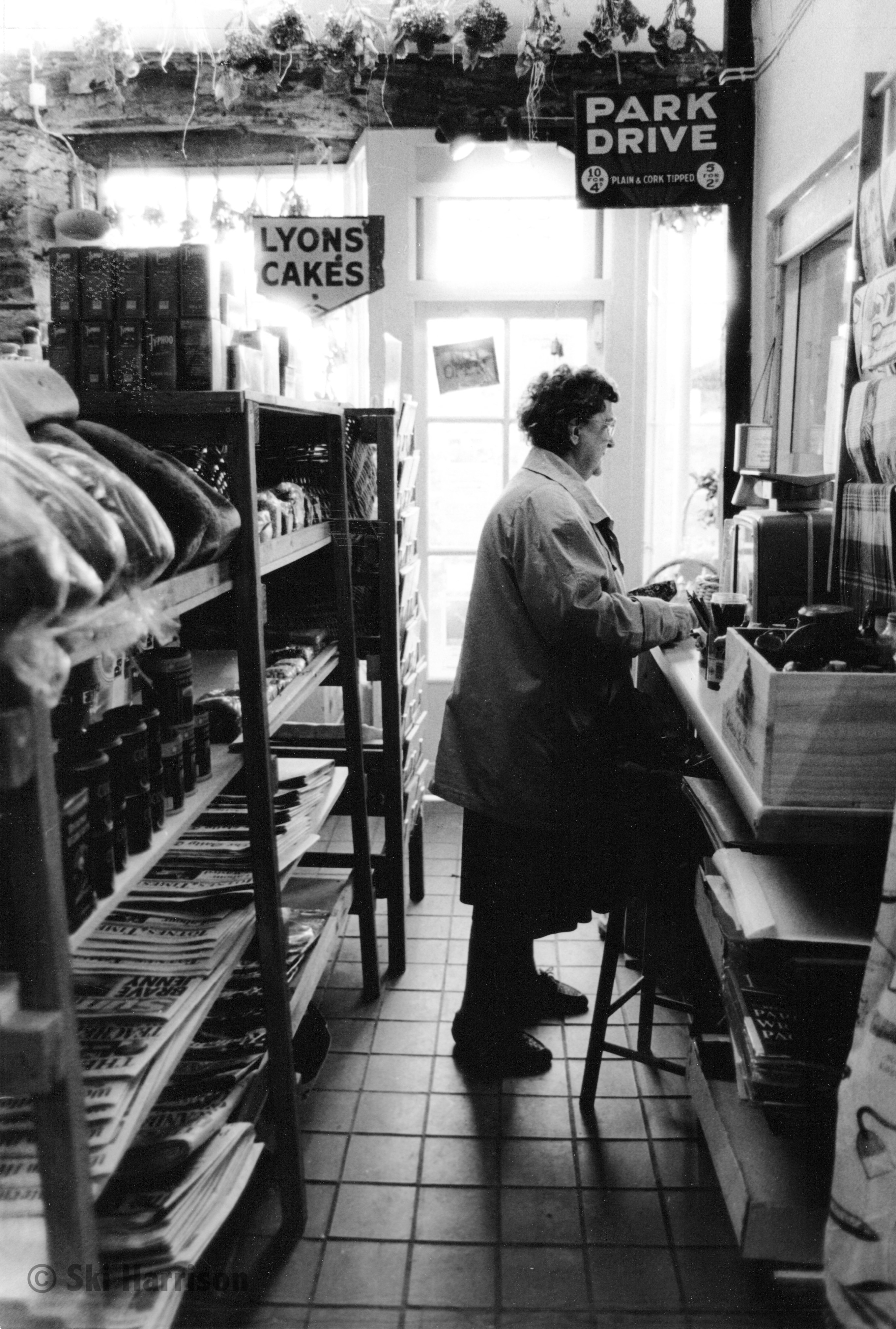 CS04 - Margaret Harding in the post office section of the shop. Cornworthy, November 1998