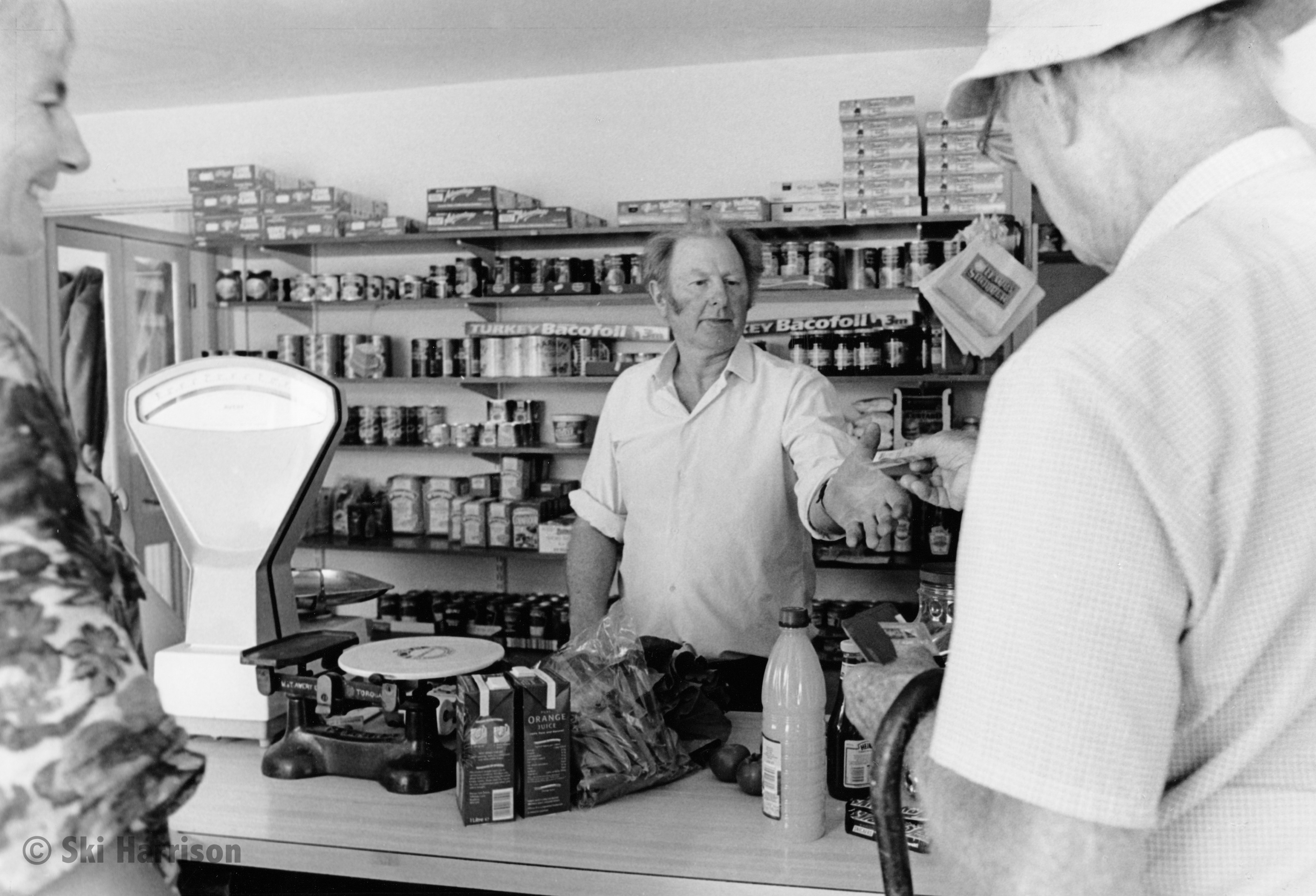 CS05 - Brian Worthington serving Roly Richardson in the Saturday shop. Cornworthy, 1999