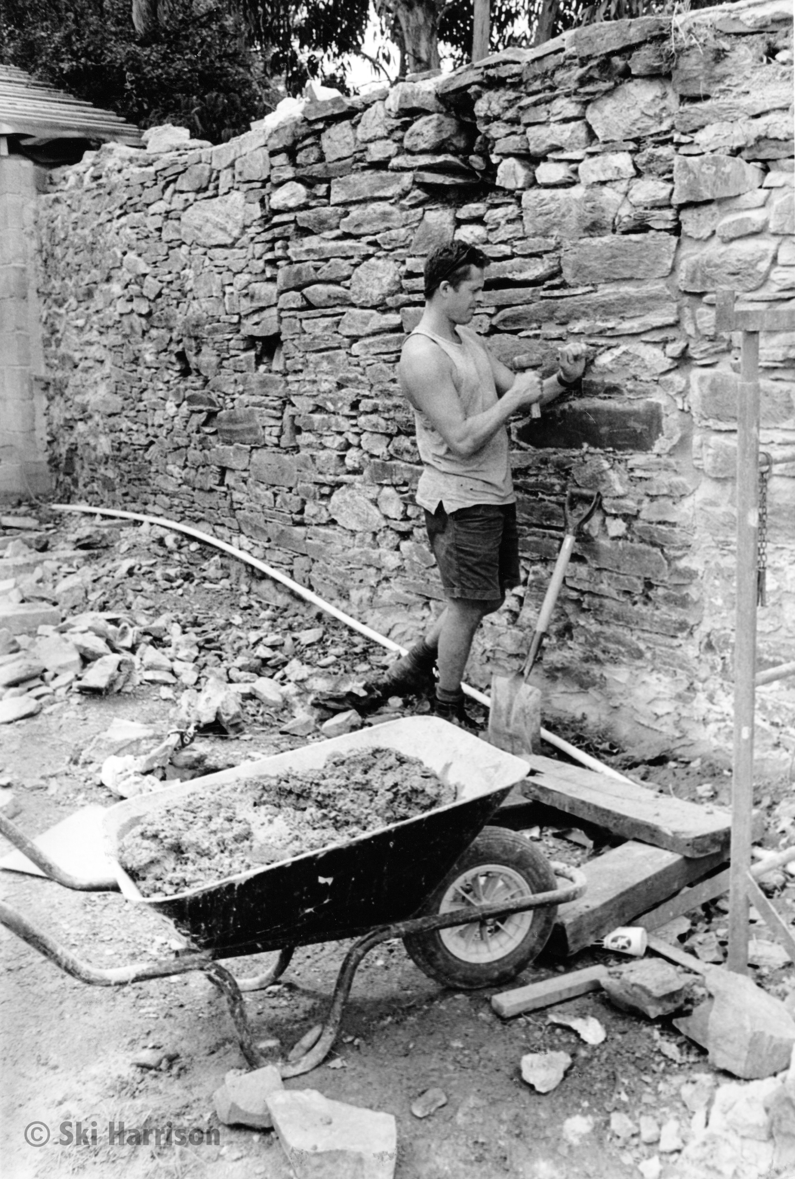 CS12 - Aaron Southgate, garden designer and constructor repairing a stone wall. Morleigh, 2000