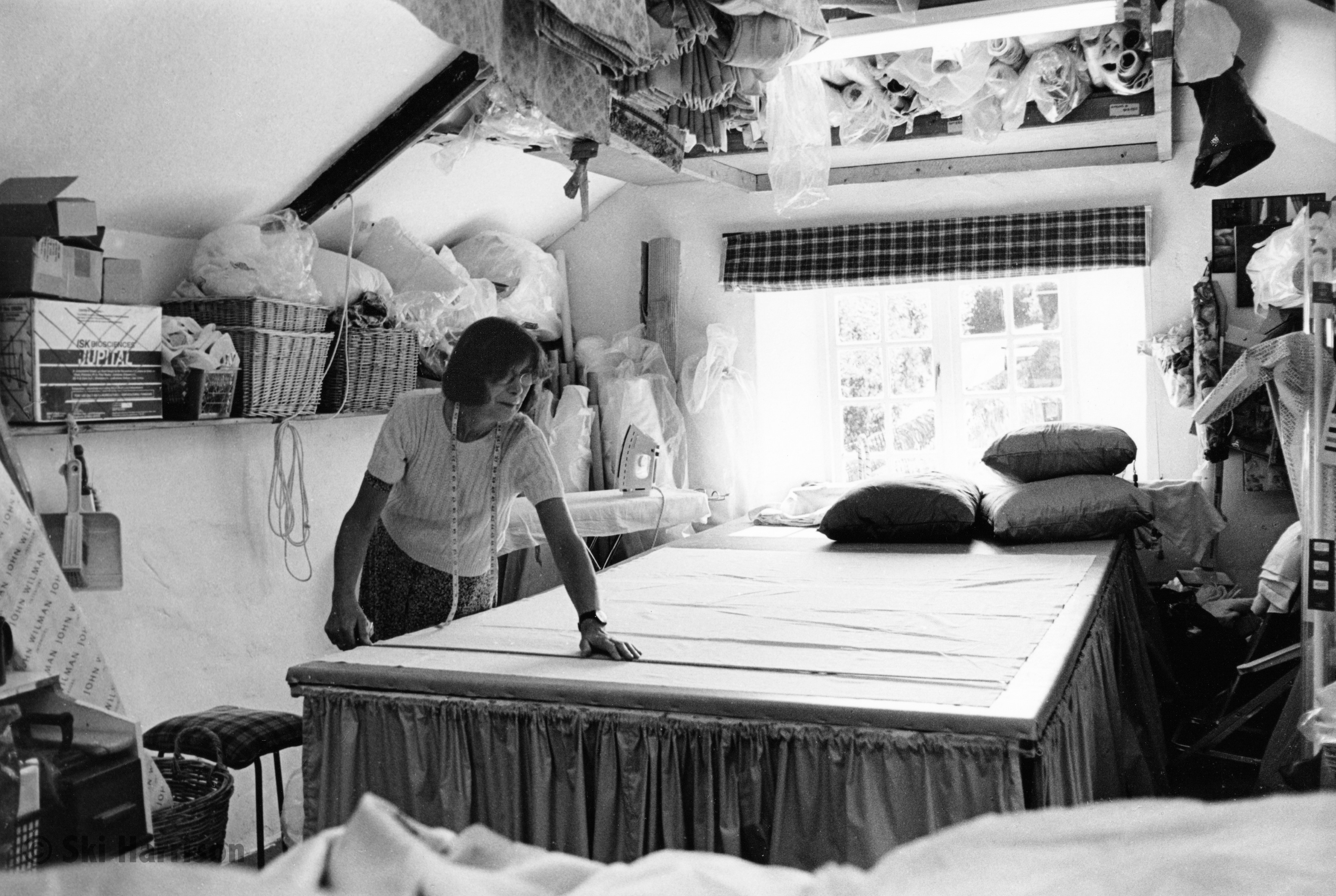 CS16 - Val Adams measuring curtain fabric. Val started her business in the late 1970s. Park Farmhouse, 2000