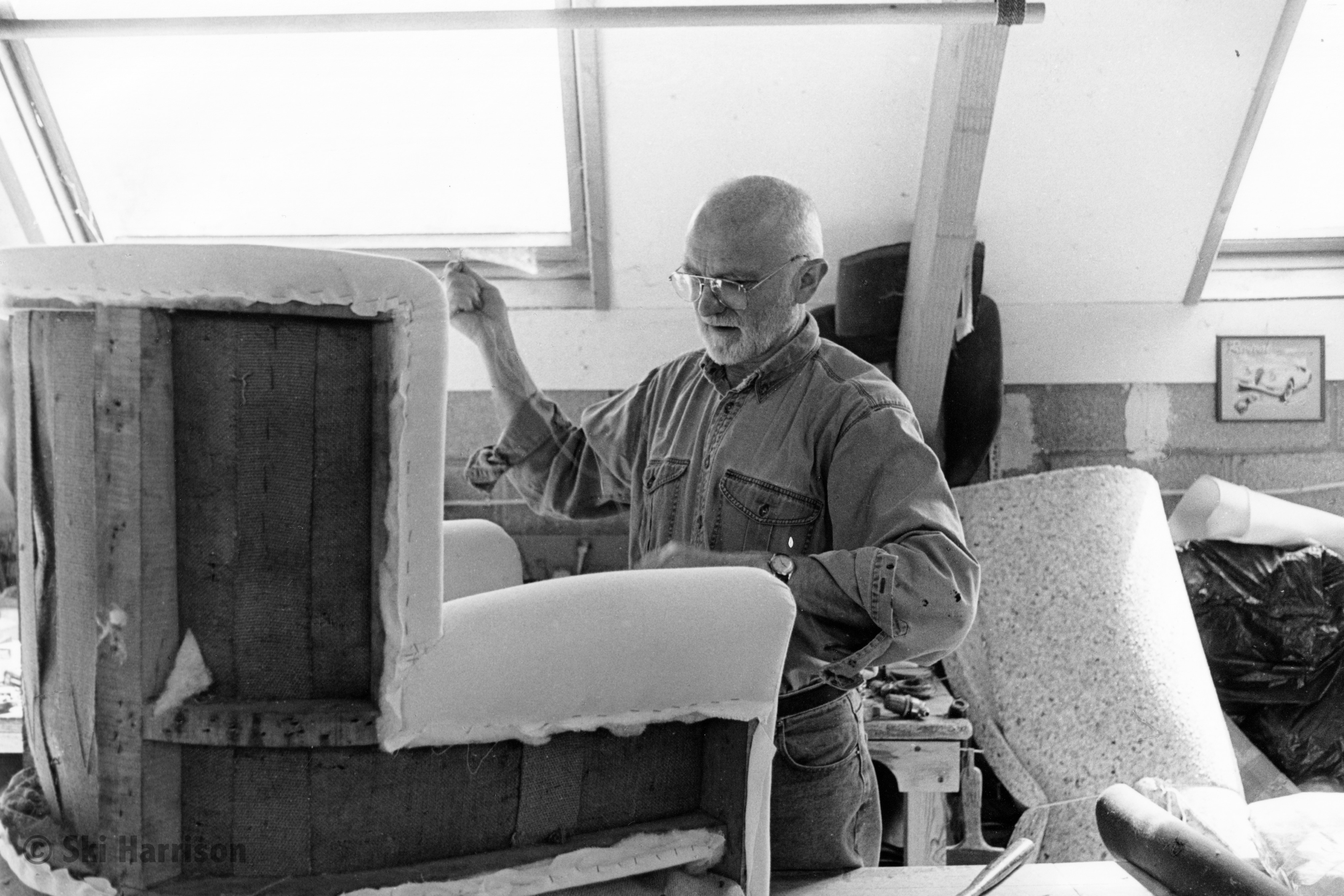 CS17 - Chris Adams, who started his business in 1986, repairing a chair. Park Farmhouse, 2000