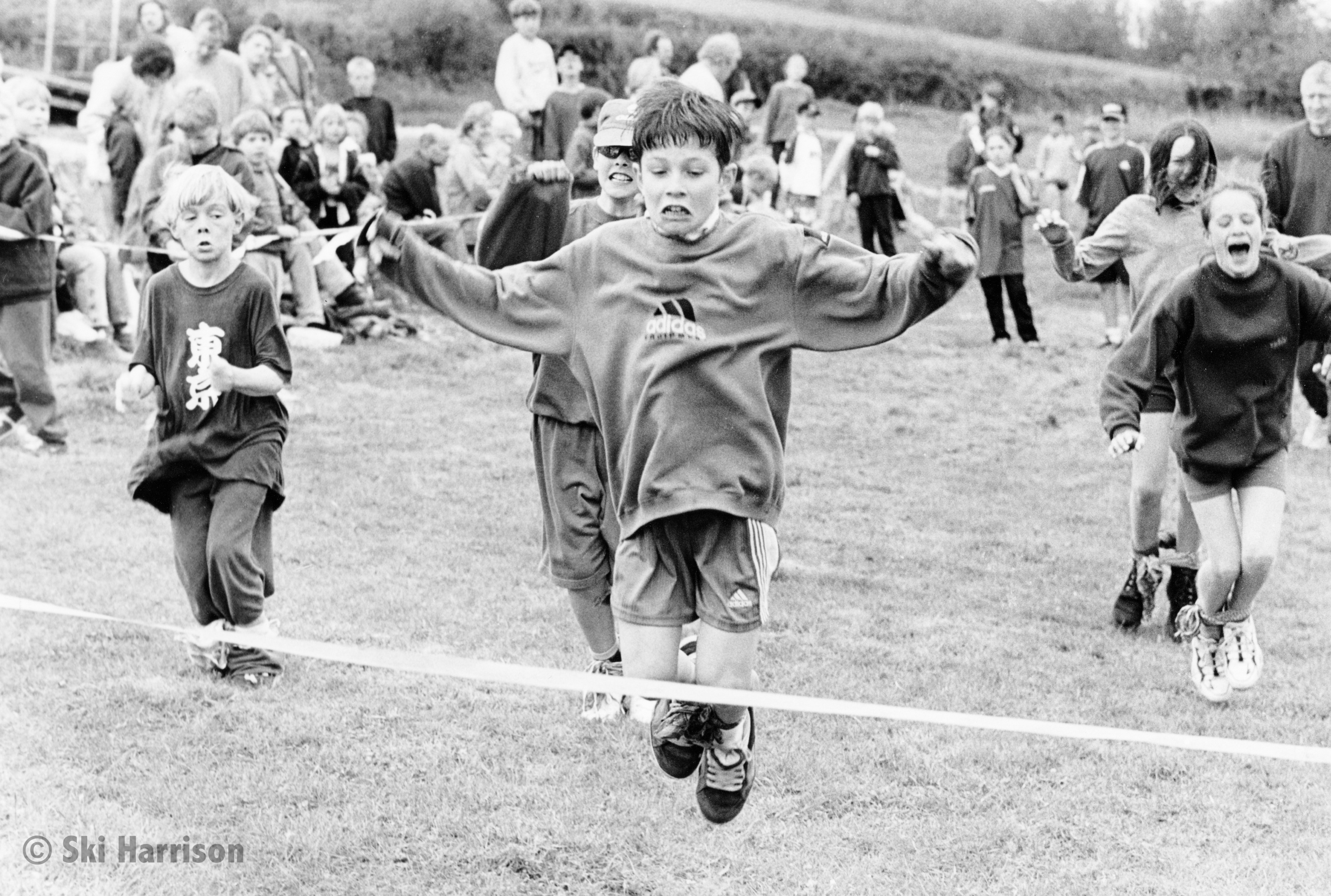 CS45 - May Bank Holiday Sports Day Bunny Hop heat being won by George Mariner. Church Meadow, Cornworthy, 1998