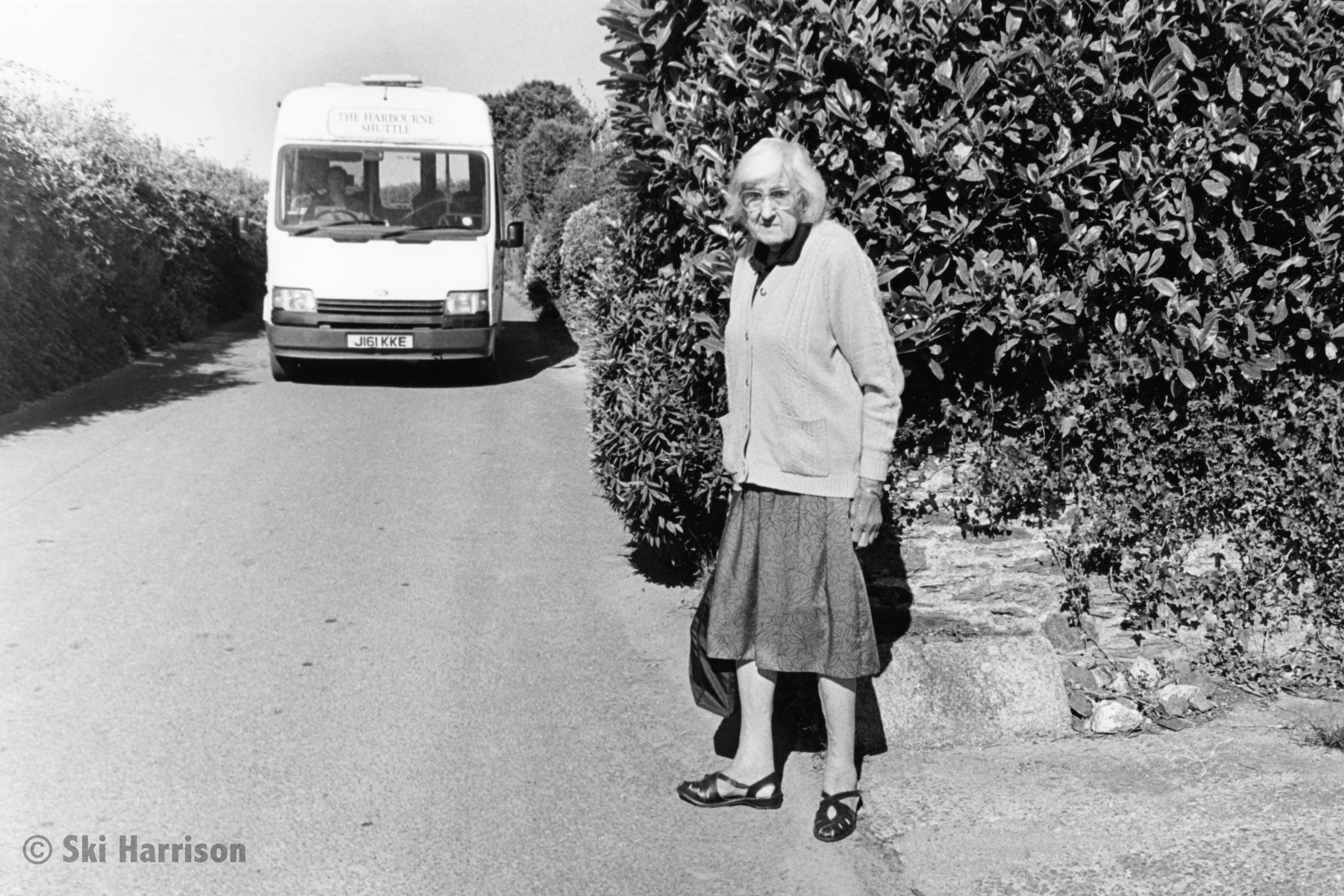 CS59 - Freda Pyne waiting for the community bus, the Harbourne Shuttle. 1999