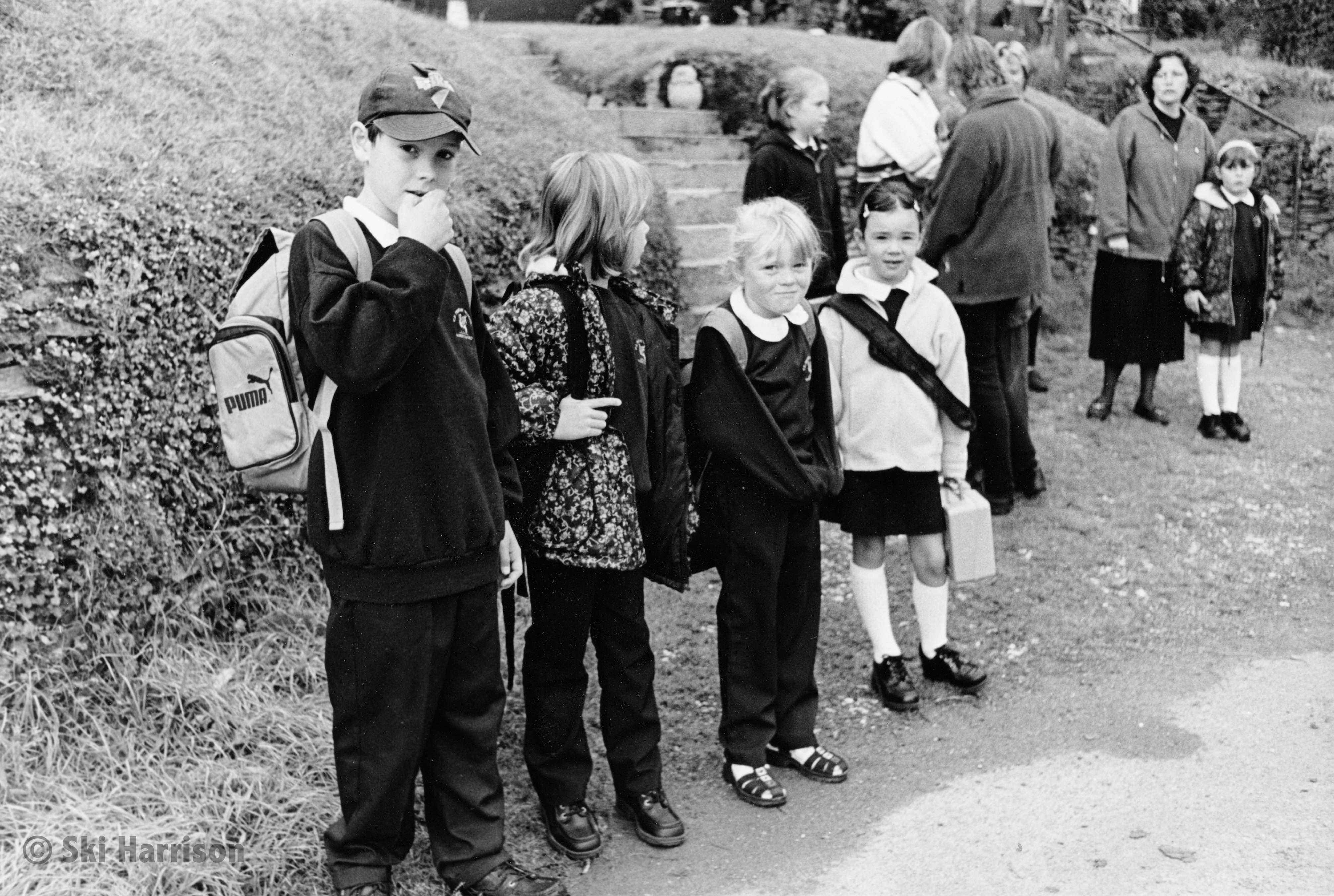 CS66 - Harbertonford School children waiting for their bus. L-R Sam Sharland, Poppy Gitsham and Emily Kirby and others. Cornworthy, 2000